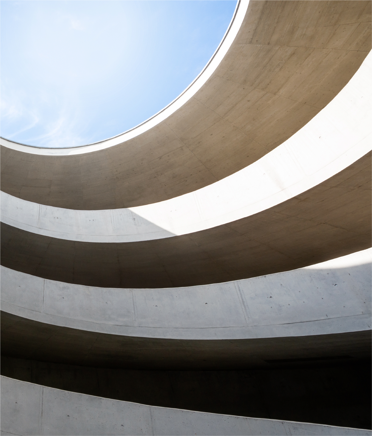 Photo looking up at cement modern architecture