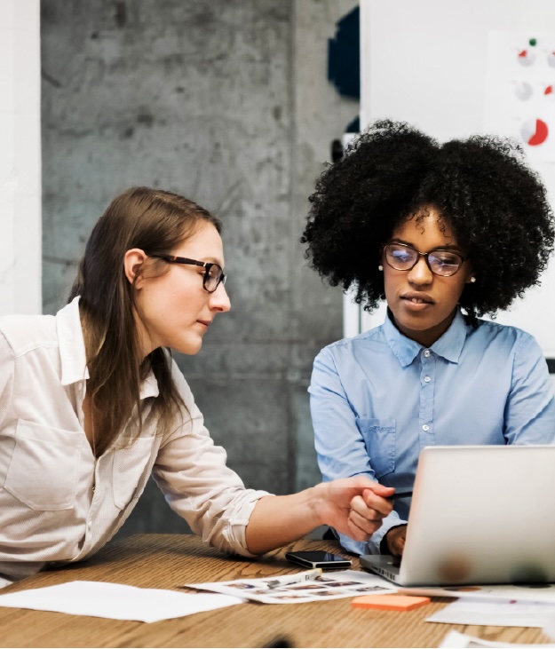 Two women have a discussion at work